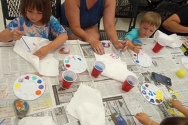 Painting rocks for William Snakespear our rock snake that lies in the garden in the front of our little library.